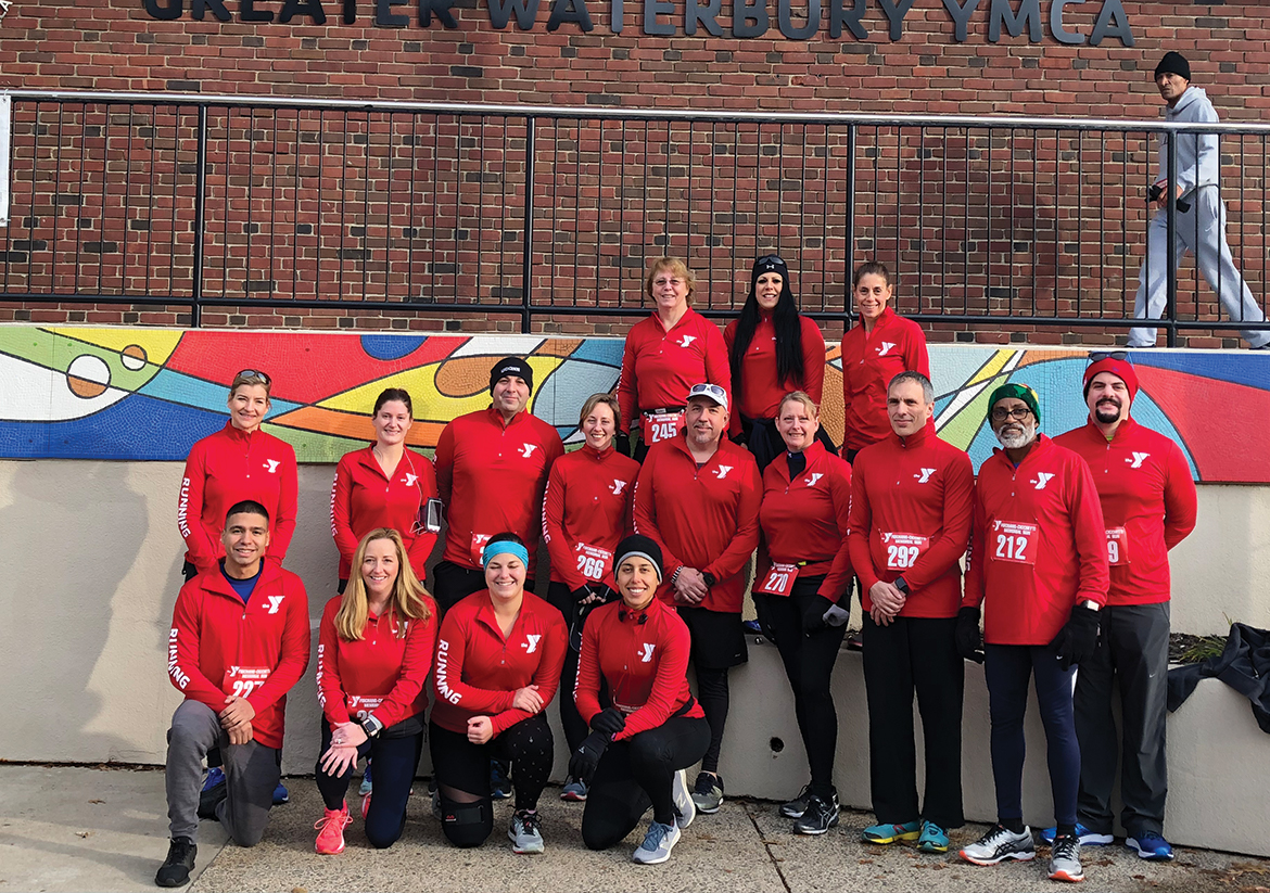 Team picture of YMCA staff participating in a road race outside of the Waterbury YMCA